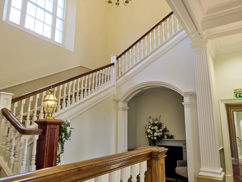 Interior of the freshly renovated and decorated The Story, Durham, highlighting the grand staircase..
