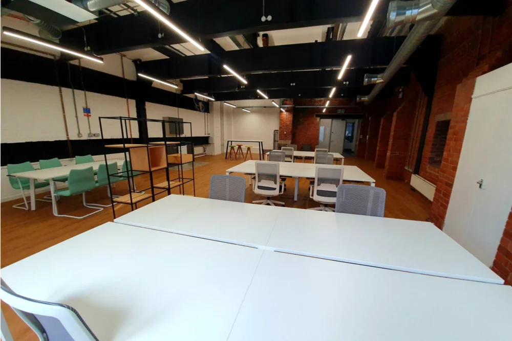 A large white wooden table in an office.